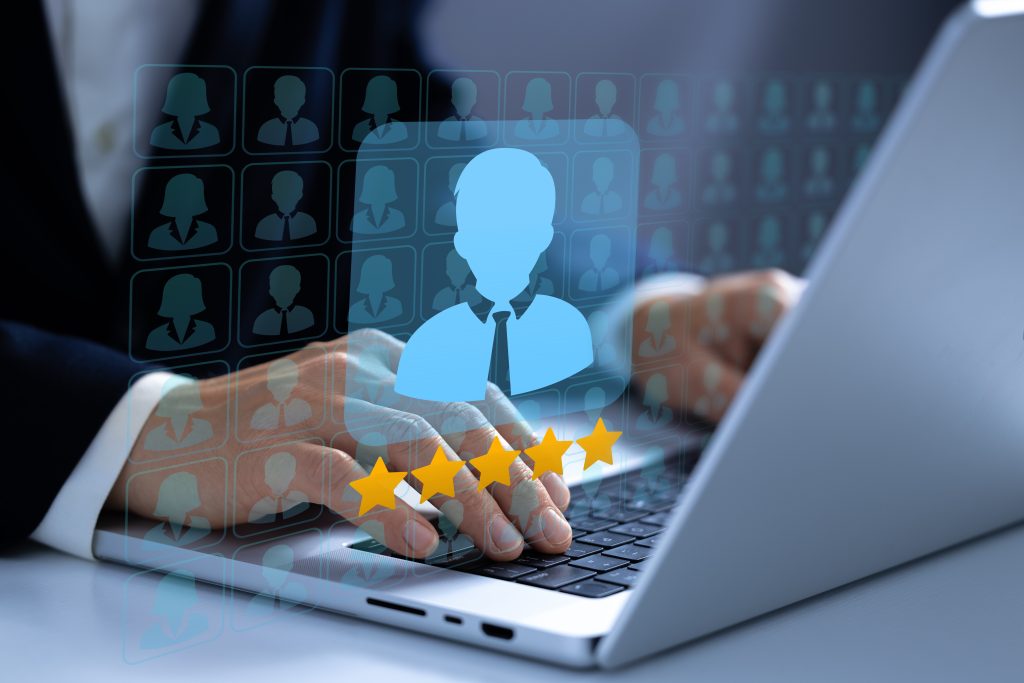 Selecting a recruitment candidate on a laptop