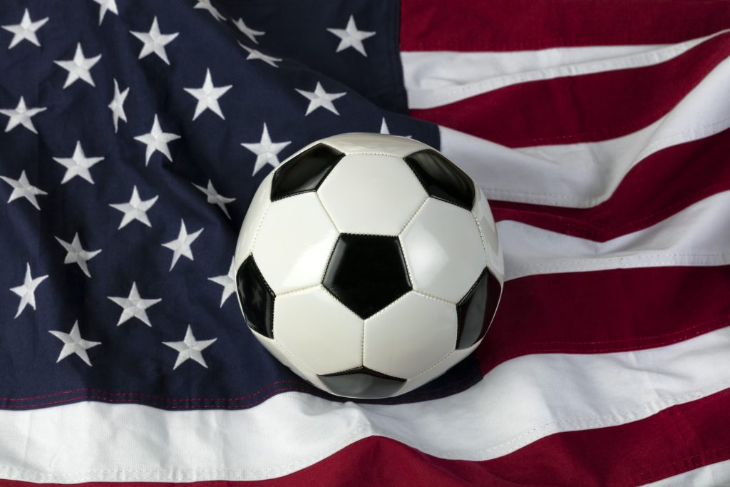 A football on a USA flag