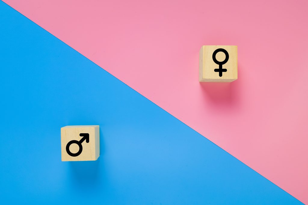 male and female symbols separated on blue and pink backgrounds
